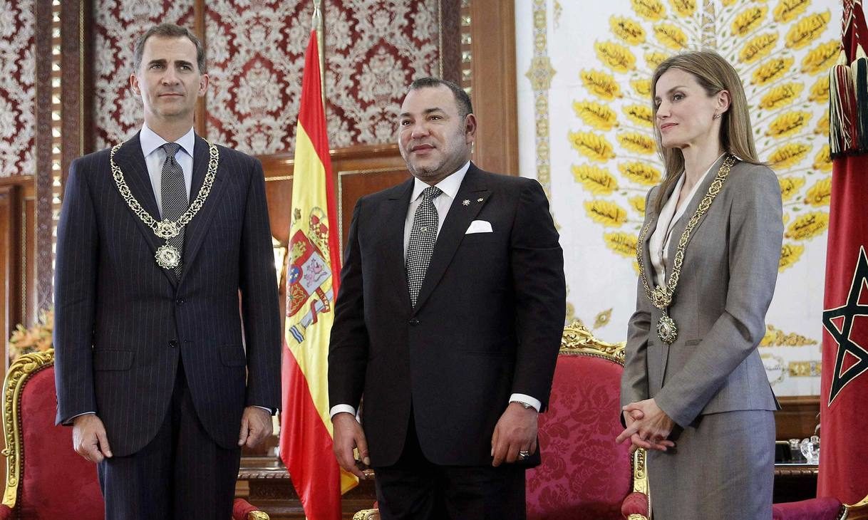 Morocco's King Mohammed VI welcomes Spain's King Felipe VI and Queen Letizia upon their arrival at the Royal Palace in Rabat